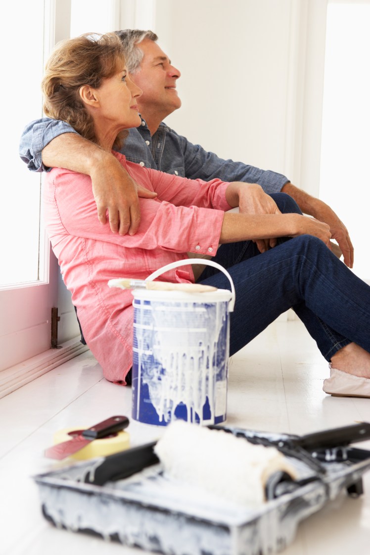 Senior couple decorating house
